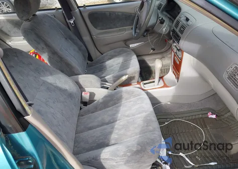 1999 Toyota Corolla Le z USA, uszkodzony, nr VIN 2T1BR12E2XC208457